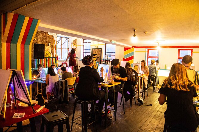 Drink & Draw: Paint A Masterpiece - The supplies are handled, canvas to apron