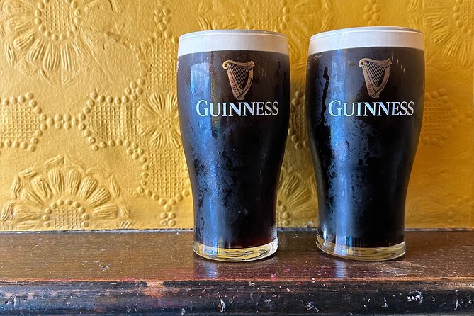 Dublin Pub Tour: Guinness Perfect Pour, Whiskey, Music and More - Hapenny Bridge whiskey stop: tasting with a postcard view