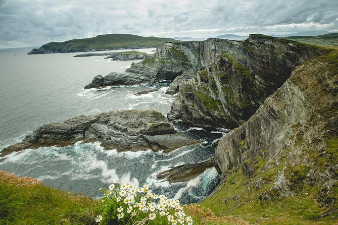 Ring of Kerry Day Tour from Cork: Including Killarney National Park - Sneem village: colorful squares, a bridge, and river-meets-bay views