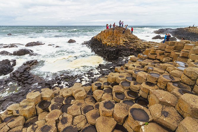 Spanish Belfast And Giants Causeway Tour - Belfast by bus: murals, Peace Wall, and famous stops from the window